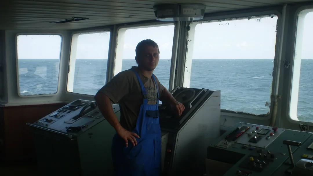 Andrei on the bridge of a Black Sea cargo vessel during transit - eight-month deployments before becoming a Bay Area appliance technician